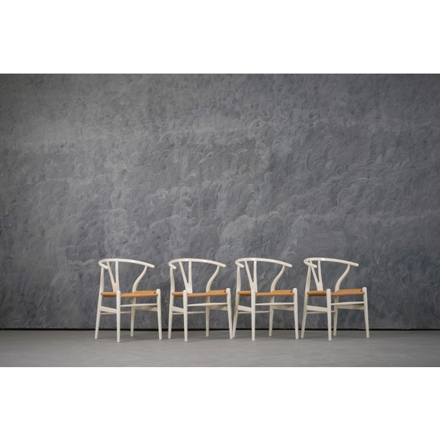 The Carl Hansen & Søn Wishbone Chair (CH24) in Natural Hardwoods celebrates Hans J. Wegner's 1949 masterpiece through the...