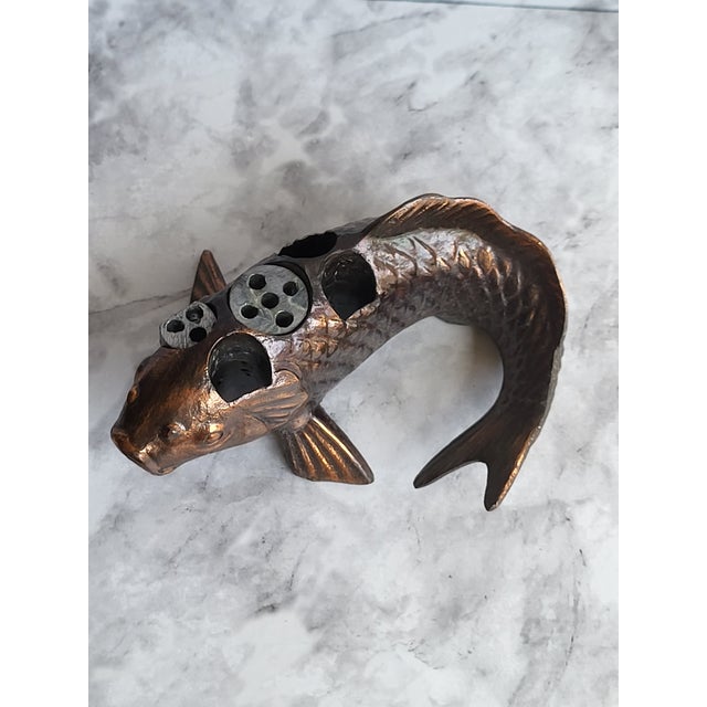 This is a beautiful Japanese solid copper Koi fish figurine. It serves as an Ikebana flower holder with two removable...