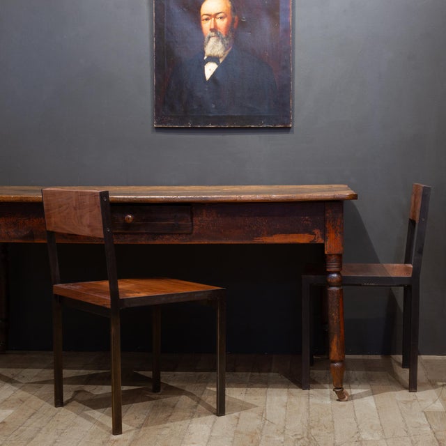 ABOUT A primitive rustic farmhouse dining table with turned legs, wooden casters and distressed, painted base. One large,...