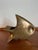 Vintage mid century brass sculptural fish ashtray featuring a bold modernist silhouette and rich golden patina. A striking...