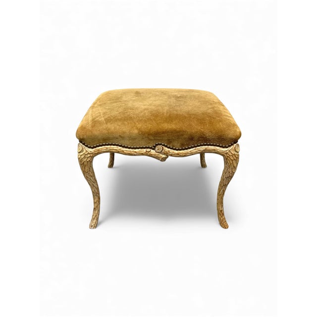 This is a mid-century Italian carved faux bois ottoman. The upholstery is gold suede. It is vintage and shows scuffs and...