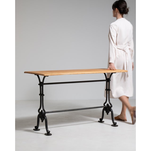 A balanced mid-size bistro table combining practicality and traditional style. The design reflects early 20th century...