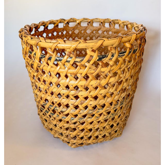 A sturdy hand-woven mid-century bamboo & rattan floor planter basket. This basket features an open weave design with a few...