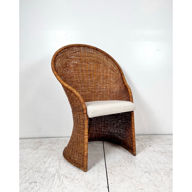 Vintage wicker fan back chair. Rounded frame with high arched back. Can work as a desk chair, or anywhere you need a touch...