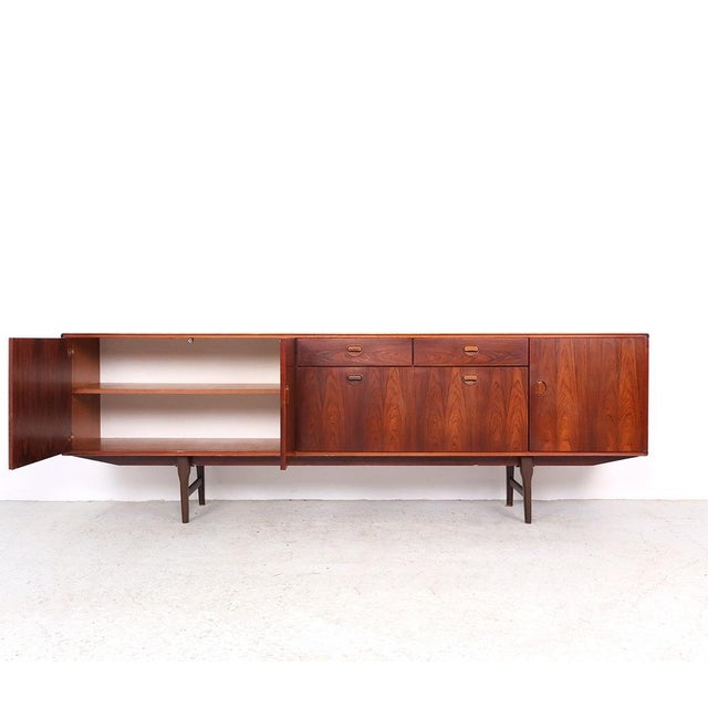 Large sideboard designed by the Fristho Design Team and manufactured by Fristho Franeker. This impressive mid-century...