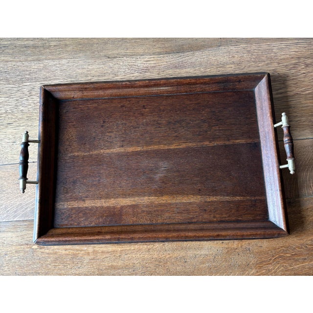 There is a quiet elegance to the small objects that once served the daily rituals of the home. This early 20th century...