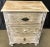 This Coastal Boho chest features three carved drawers and is crafted from solid wood with a driftwood finish, perfect as a...