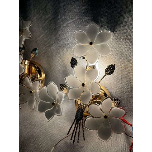 An elegant pair of Hollywood Regency wall sconces by Gealux, crafted in the 1970s. Featuring hand-formed glass flowers...