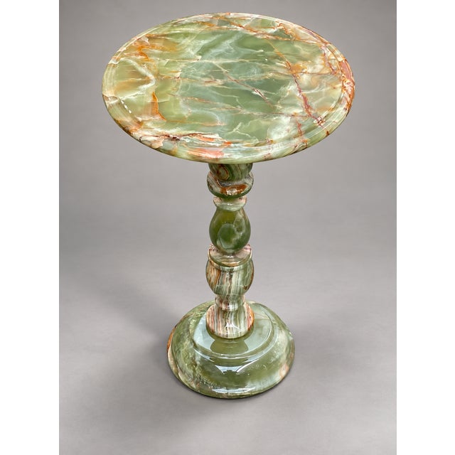 Elevate your space with this exquisite handcrafted onyx marble pedestal side table. Expertly carved from premium onyx...