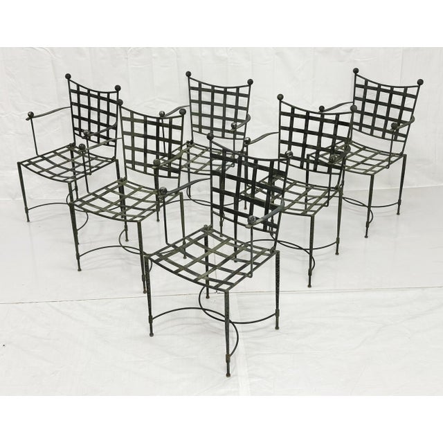 An exceptional set of six wrought iron outdoor armchairs designed by Mario Papperzini for Salterini, among the most iconic...