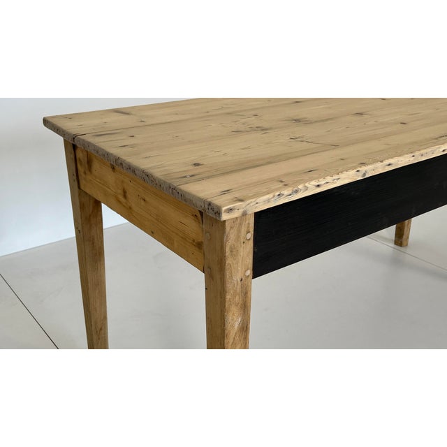 Large country-style table from a French farmhouse with a lacquered metal trim (3mm) on the long sides. The table is ideal...