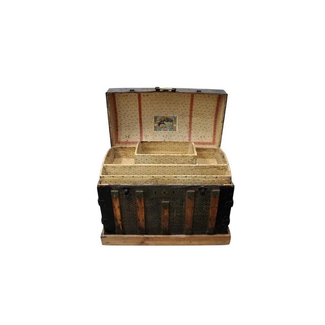 C. 20th Century Dome Top Trunk w/ Embossed Metal Star Design on stand w/ Casters. Original Papered Shelf Insert & Brass...