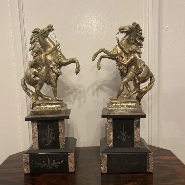Pair of late 1800s French Slate and specimen marble Garnitures with incised decoration supporting Gold Gilt Cast Metal...