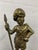 Antique brass Figural Highlander with appropriate outfit including kilt, sash, purse,headgear and staff. Nice detailing of...