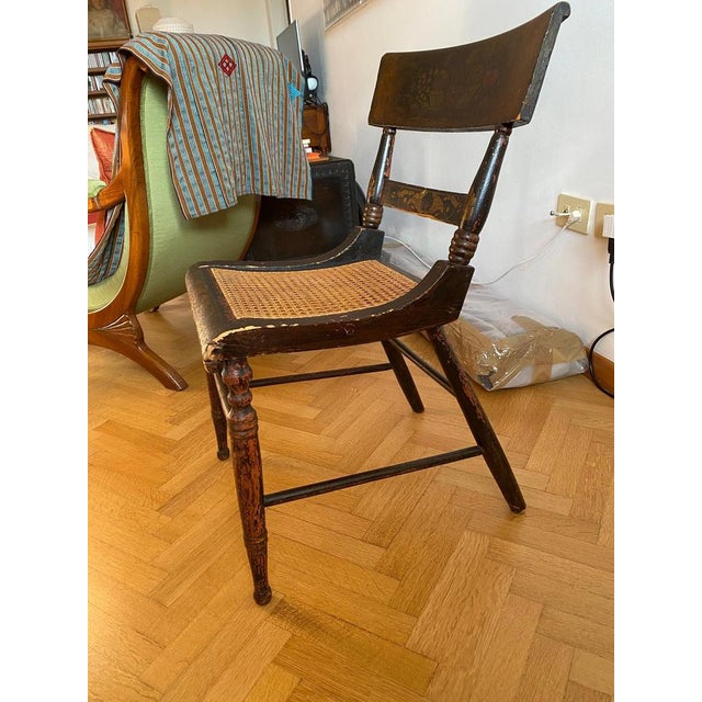 Splendid Hitchcock chair still with the original decorations and caning. Most of the original floral decoration is still...
