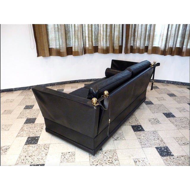 This high quality classical style (so-called 'Knole' type) two-seater leather sofa was manufactured in Germany in the late...