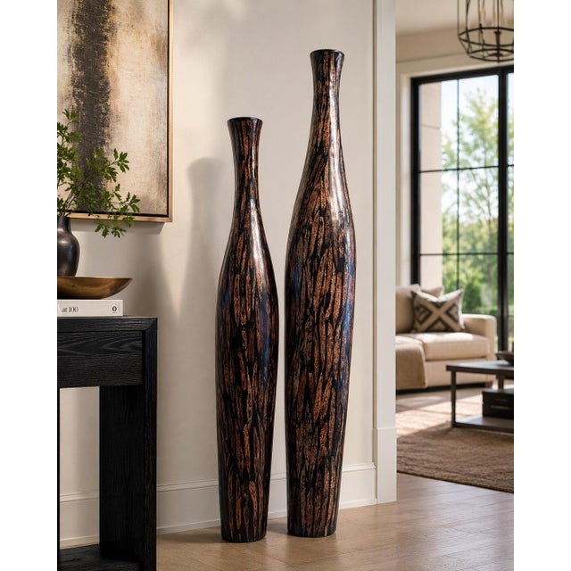 Striking pair of contemporary floor vases from the Eva Collection in Cotton Husk finish. Measuring 40" and 48" tall, these...