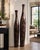 Striking pair of contemporary floor vases from the Eva Collection in Cotton Husk finish. Measuring 40" and 48" tall, these...
