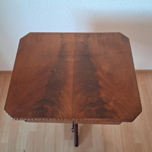 Fine mahogany sewing table, circa 1840–1870. Turned central pedestal, three-legged base, two drawers, and original...