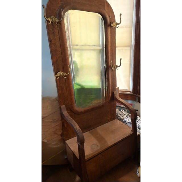 Wood Turn-of-the-Century Victorian Carved Oak Hall Tree Bench With Original Brass Hardware & Mirror For Sale - Image 7 of 12