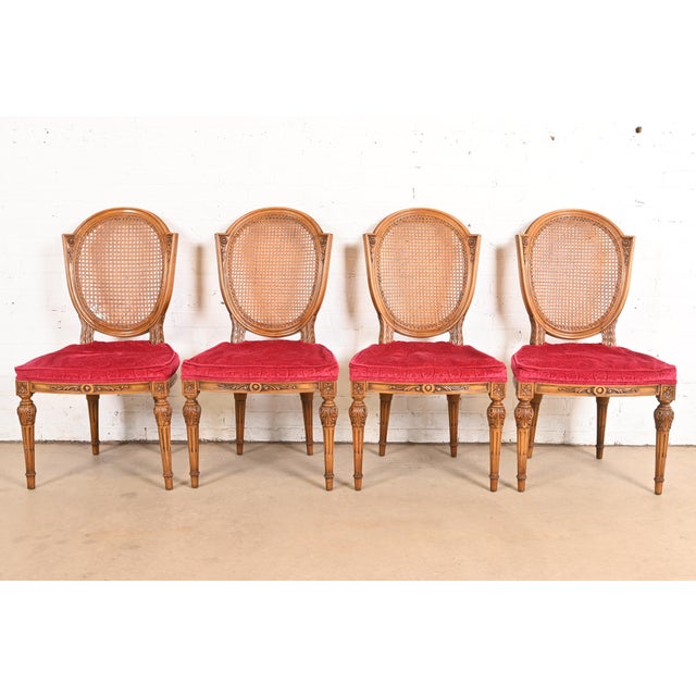 A gorgeous set of four French Regency Louis XVI style dining chairs Attributed to Karges USA, Circa 1960s Carved solid...