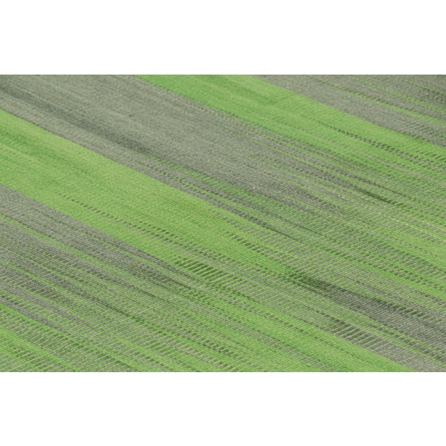 Handwoven in wool, this 9x13 Kilim is from an inventive new contemporary flat weave collection by Rug & Kilim. On the...