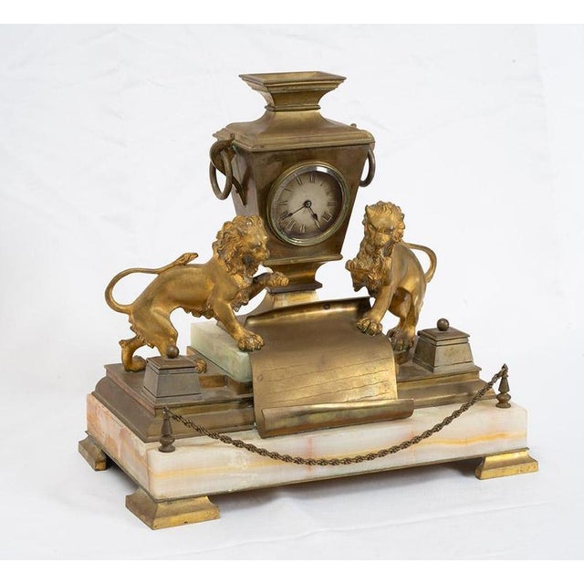 Antique inkwell with a built-in clock, crafted from gilded bronze and onyx, dating from the Napoleon III period in the...