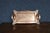 Art Nouveau copper serving tray with integrated side handles and embossed stylized leaf motifs at each corner. The tray...