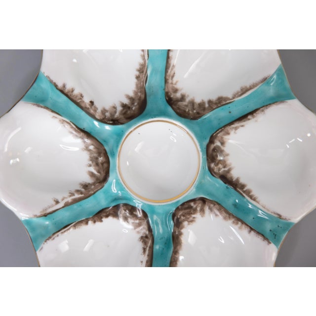 A gorgeous antique French porcelain oyster plate attributed to Limoges, circa 1900. This fine quality oyster plate has six...