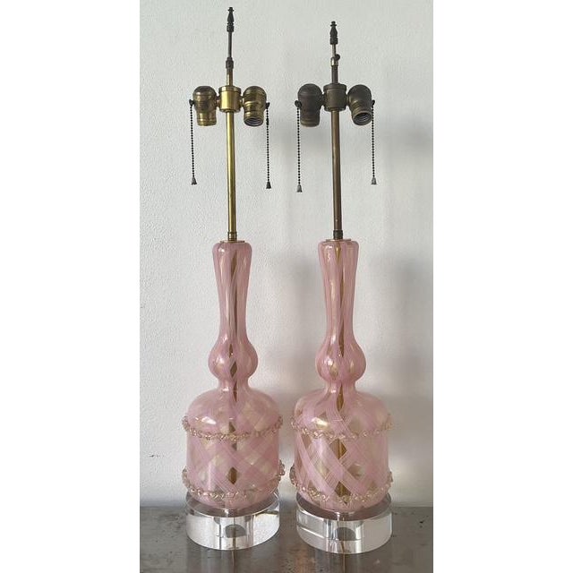 This stunning pair of vintage Murano glass lamps epitomizes the mid-century glamour of Venetian artistry. Hand-blown with...