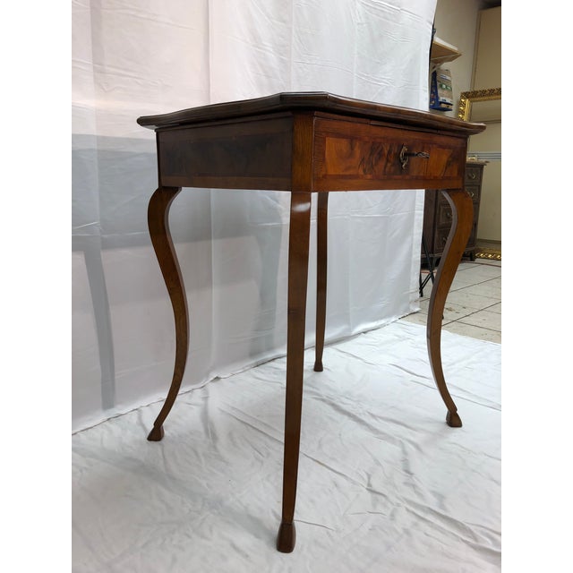Beautiful 19th century Italian vanity table. Raised on 4 solid oak cabriolet carved legs below a hinged flip top of...