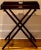 A handsome late 19th century English mahogany butler’s tray on stand, dating to circa 1890. This versatile table features...