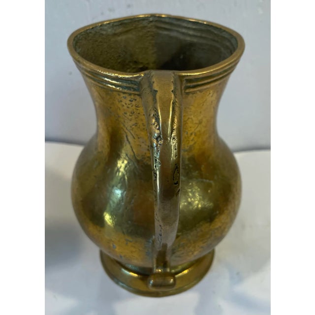 This may actually be a mug. It is extremely heavy and could have been made in the 1800s.