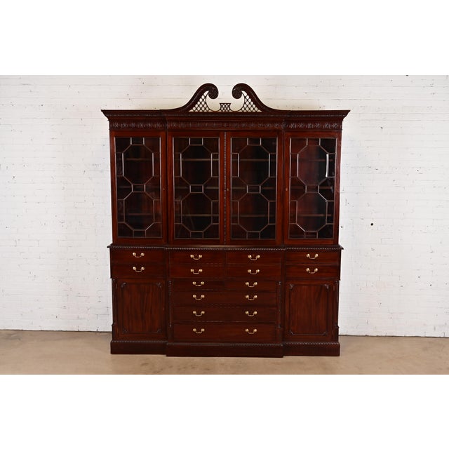 An outstanding English Georgian or Chippendale style monumental breakfront bookcase cabinet with drop front secretary desk...
