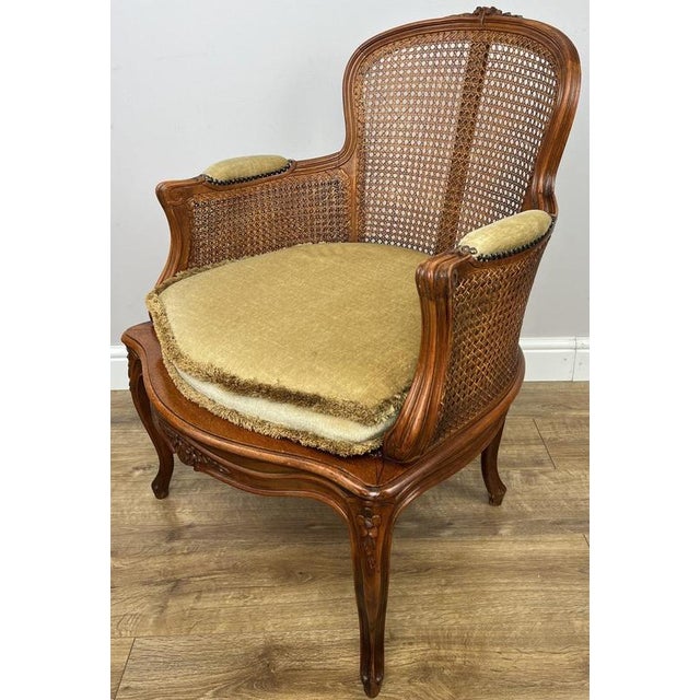 Bring timeless French elegance into your home with this Vintage French armchair , beautifully combining an elegant cane...