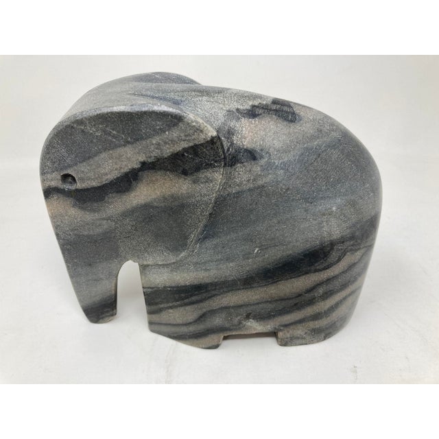 Vintage Italian elephant in black hand carved marble stone stylized figure. Hand-carved black stone abstract sculpture in...