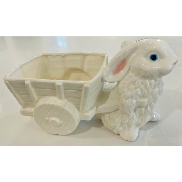 This charming vintage ceramic planter features a sweet white rabbit pulling a decorative cart. Beyond plants, this...