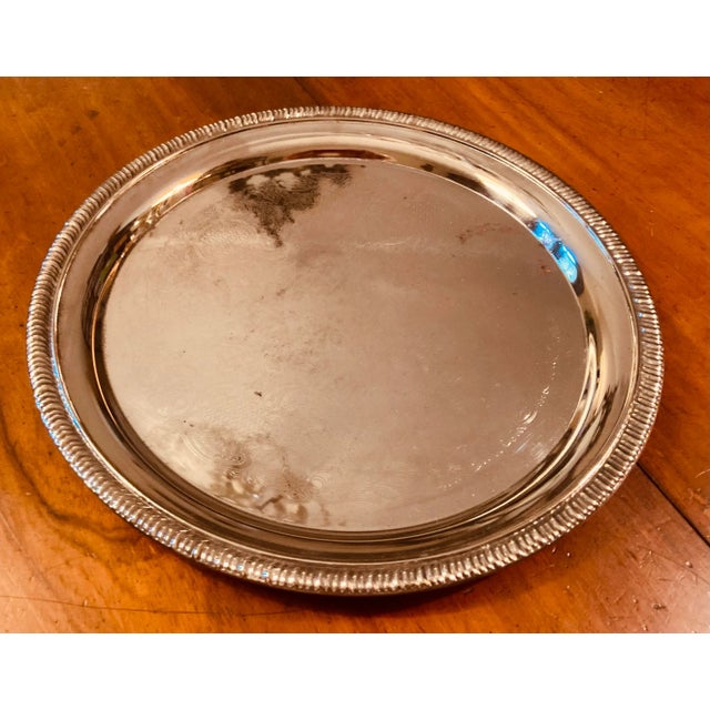 Polished aluminum serving tray, elaborate patterned center scrolled lip edge