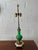 A striking antique French Louis XVI–style table lamp featuring a vibrant green opaline glass body adorned with ornate gilt...