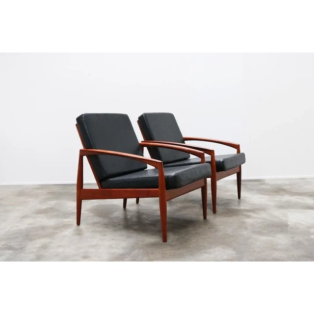 Rare pair of 'Paper Knife' model 121 lounge chairs in teak and black leather (faux) design by Kai Kristiansen for Magnus...