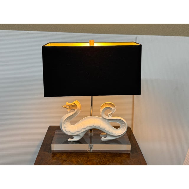 Design Plus Gallery presents the Dragon Table Lamp from Jonathan Adler. The table lamp is simply striking with its white...