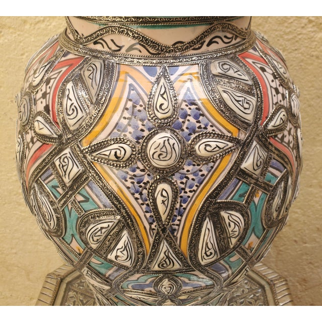 Multi-color ! Made in Fez, Morocco, this incredible hand painted metal vase is adorned with resin dots, giving it a very...