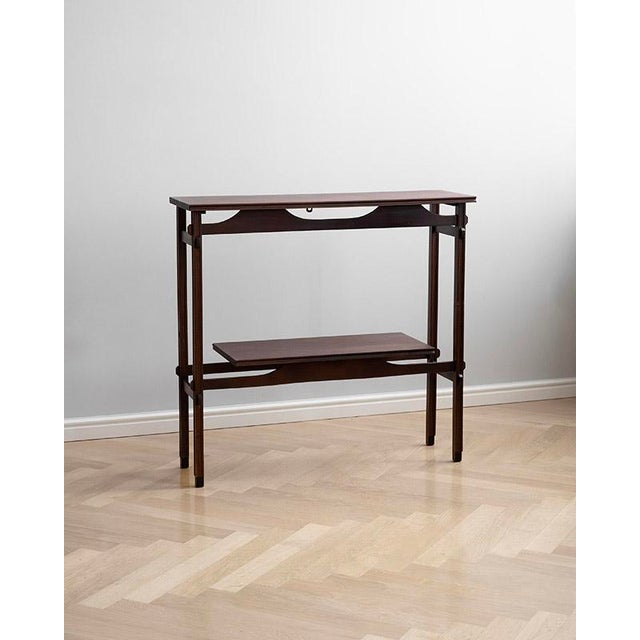 This elegant, mahogany piece comes from Denmark. It is a great example of Scandinavian design, combining clean lines with...