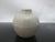 Antique, possibly Southeast Asian celadon tone pottery. Small jarlet with bulbous body. Measures 2 3/4" tall x 2 1/2"...