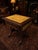 An elegant Regency-style mahogany drop-leaf side table, combining classical proportions with a beautifully aged gilt-...