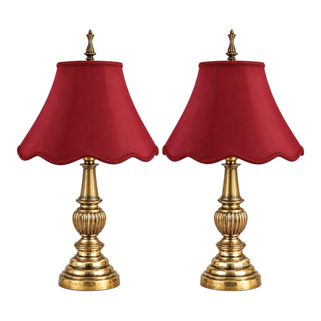 Mid 20th Century Neoclassical Urn Solid Brass Lamps With Deep Red Scalloped Bell Shades - Pair For Sale