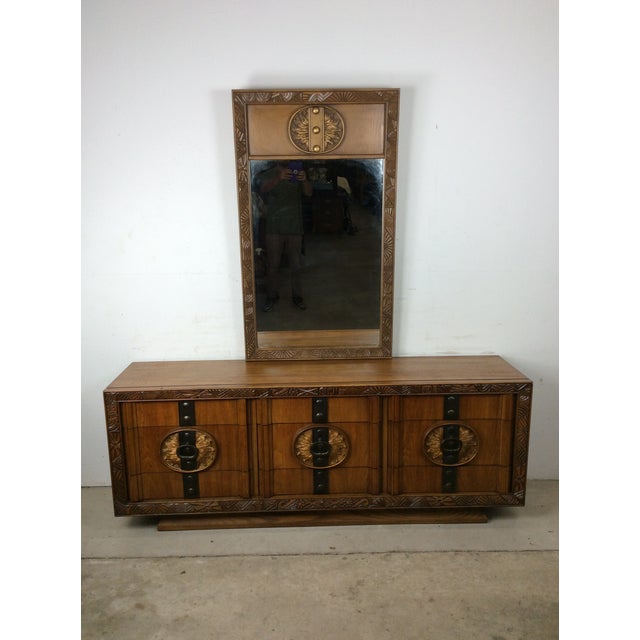 This mid century modern lowboy dresser features hardwood construction, unique oak veneer with original finish, carved wood...