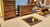 Queen bedroom set with warm honey-brown finish and traditional Colonial-inspired styling, featuring a spindle-and-panel...