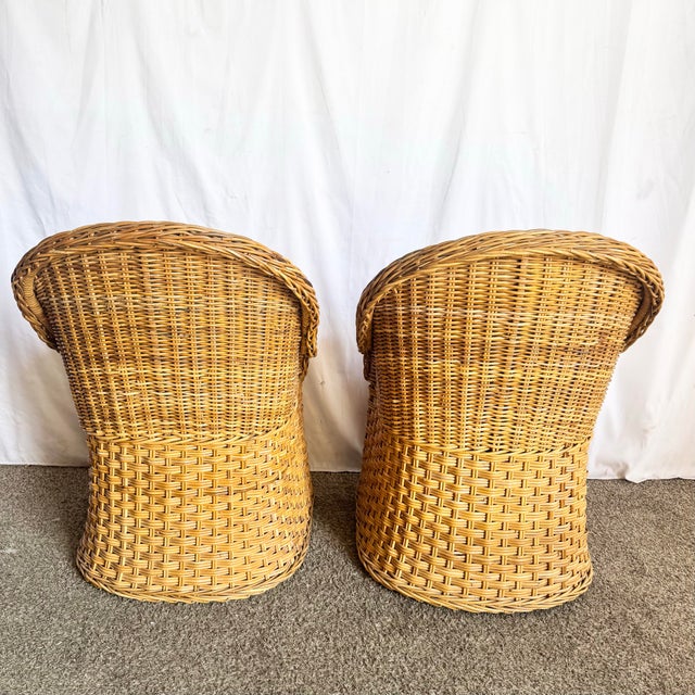 This inviting pair of vintage Boho Chic wicker lounge chairs captures the relaxed elegance of classic Florida interiors....