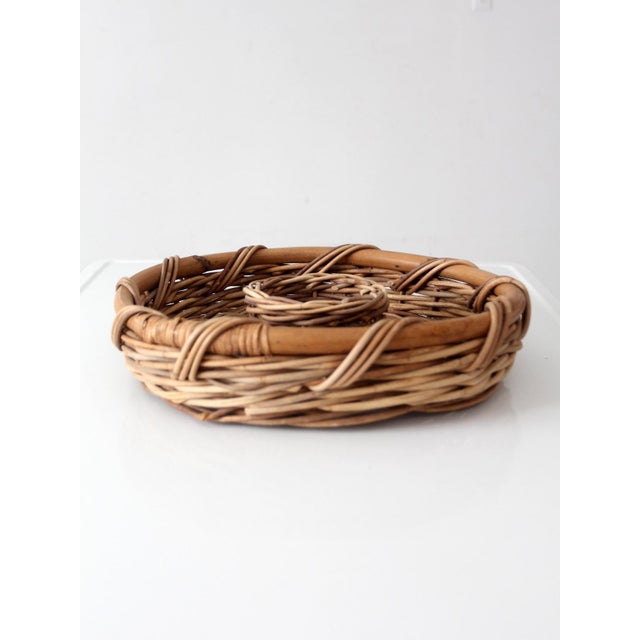 Vintage wicker chip and dip basket featuring a woven center well designed for dips, nuts, olives, or other small bites....
